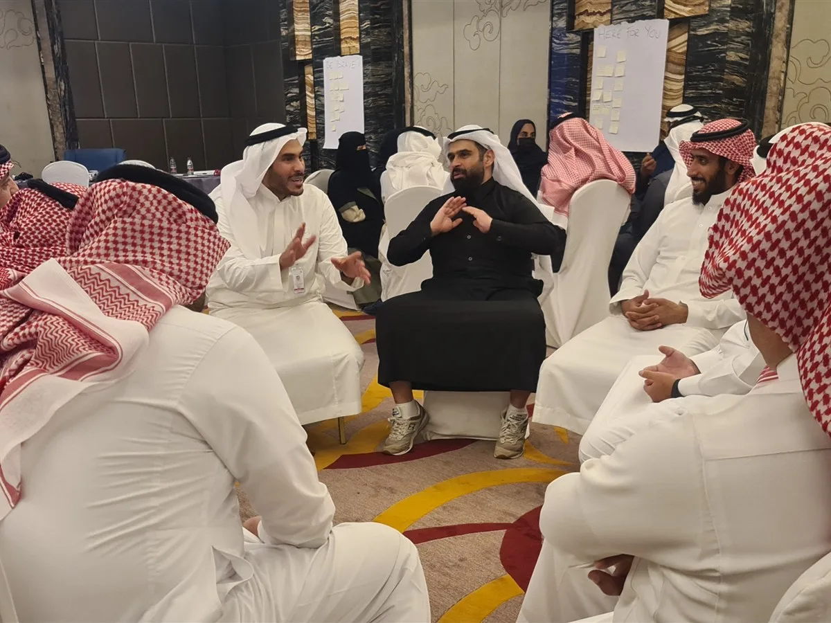 Leaders in a small-group discussion during a leadership program in Riyadh